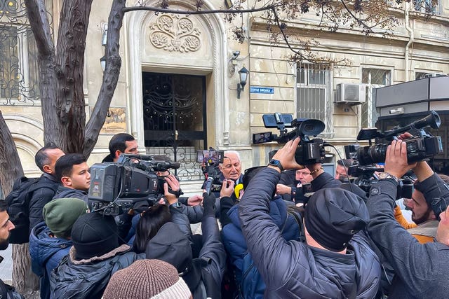 Journalists gather in front of the Iranian embassy in Baku, Azerbaijan