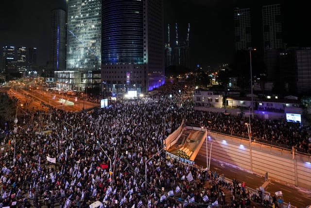 Israelis protest against the plans by Prime Minister Benjamin Netanyahu’s new government to overhaul the judicial system, in Tel Aviv