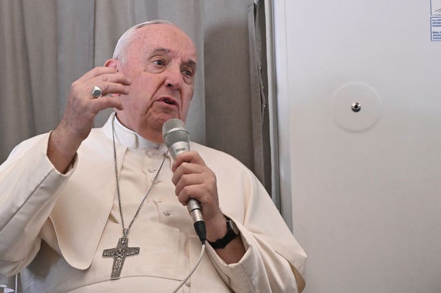 Pope Francis meets journalists during an airborne press conference aboard the plane directed to Rome, at the end of his pastoral visit to Congo and South Sudan