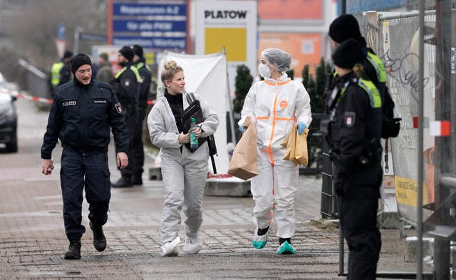 Investigators secure evidence from the building