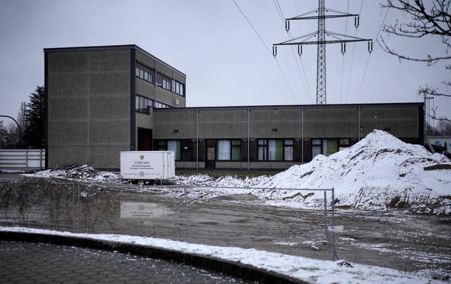 A Jehovah’s Witness building is seen behind a fence in Hamburg