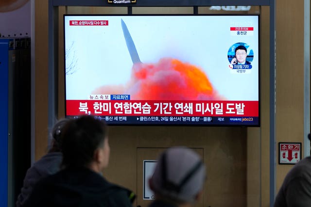 A TV screen showing news reports about North Korea’s missile launch