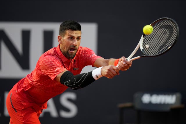 Novak Djokovic wears a protective sleeve over his elbow in Rome