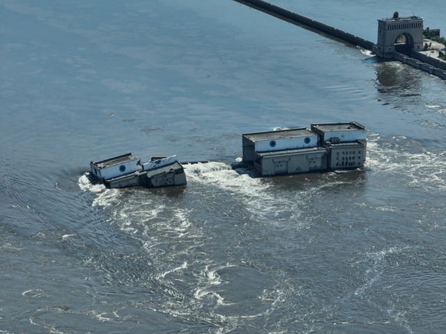 Water flows over the collapsed Kakhovka dam in Nova Kakhovka, in Russian-occupied Ukraine