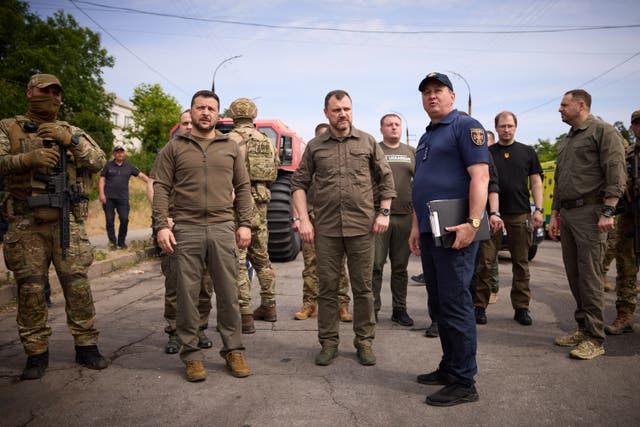 Ukrainian President Volodymyr Zelensky visits the flood-hit areas in Kherson, Ukraine
