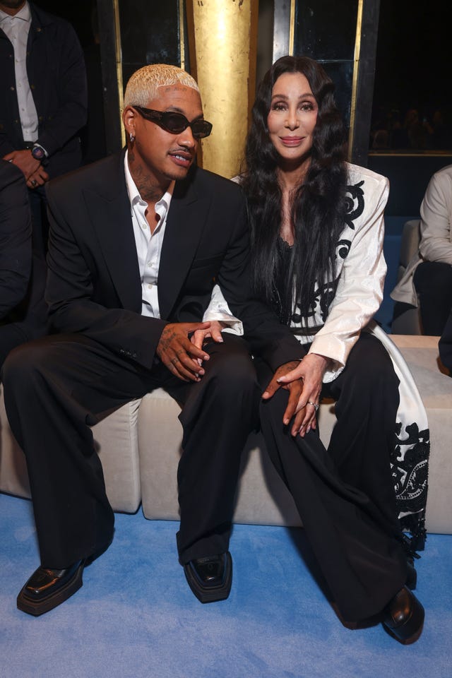 Cher, right, and Alexander Edwards attend the Balmain Spring/Summer 2024 womenswear fashion collection presented Wednesday, Sept. 27, 2023 in Paris