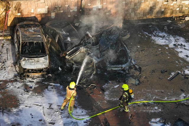 Israeli firefighters extinguish a blaze