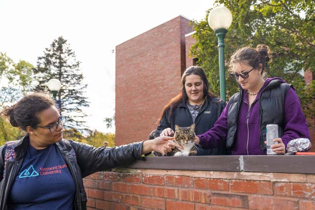 Students with Max the cat