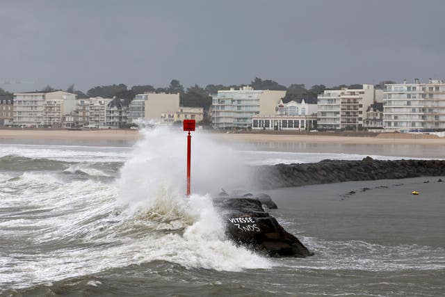 A wave hits a beach in Brittany