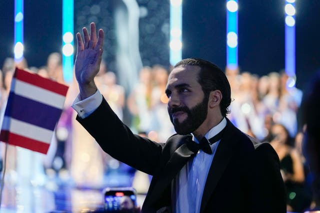 El Salvador’s President Nayib Bukele waves while attending pageant in San Salvador on Saturday