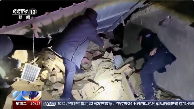 Image taken from video footage of rescuers work near the rubble from the earthquake