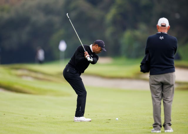 Tiger Woods plays a shot at Riviera Country Club