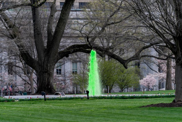 The fountain on the North Lawn of the White House is dyed green for St Patrick’s Day