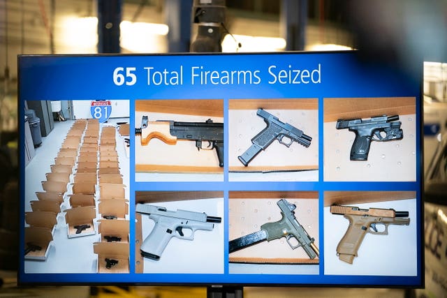 A photo of firearms seized is displayed during a news conference regarding an investigation into the theft of gold from Toronto’s Pearson International Airport, in Brampton, Ontario, Canada 