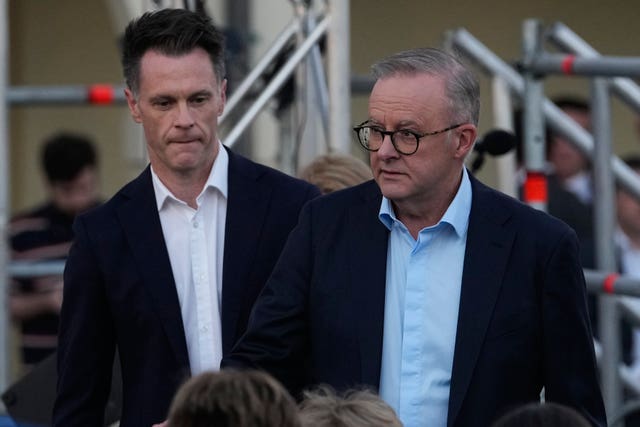 =Australian Prime Minister Anthony Albanese, right, at a candlelight vigil 