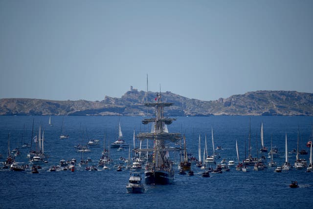 The Belem, the three-masted sailing ship which is carrying the Olympic flame, is accompanied by other boats approaching Marseille, southern France