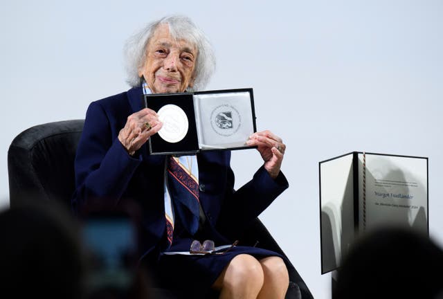 Margot Friedlander shows the Mevlude Genc Medal after it was awarded to her at the Bode Museum in Berlin in June 2024