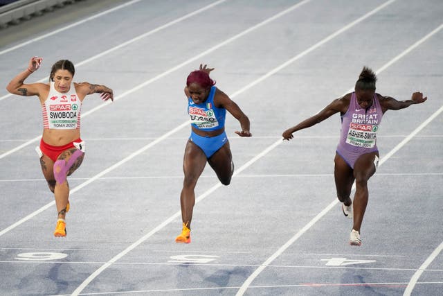 Dina Asher-Smith, right, crosses the line