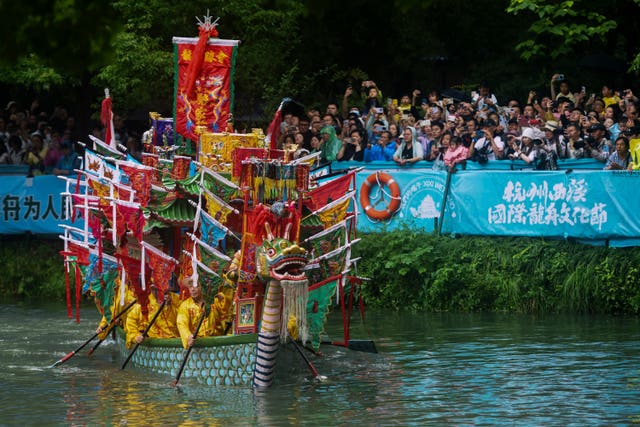 People in a colourful boat