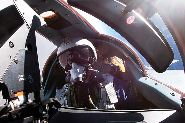 A pilot sits in a cockpit of a MiG-31 fighter jet of the Russian air force during joint Russian-Belarusian drills