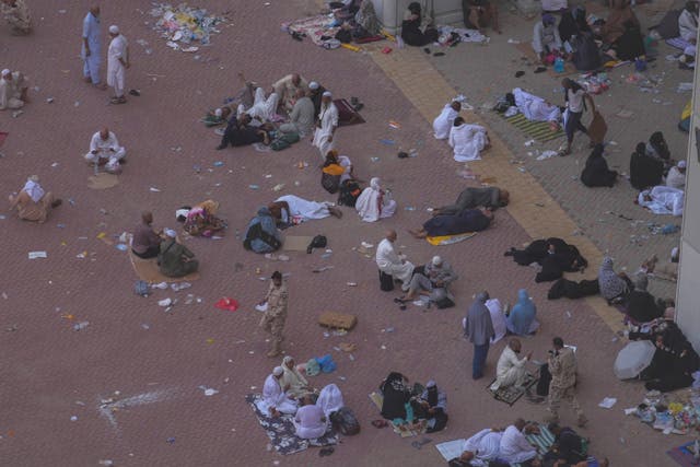 Muslim pilgrims rest after casting stones at pillars in the symbolic stoning of the devil, the last rite of the annual hajj, in Mina, near the holy city of Mecca