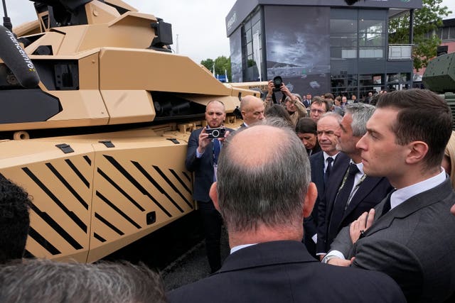 Mr Bardella looks at a Leclerc Evolution battle tank