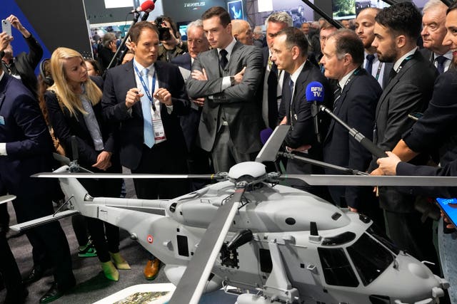 Mr Bardella surveys a helicopter model