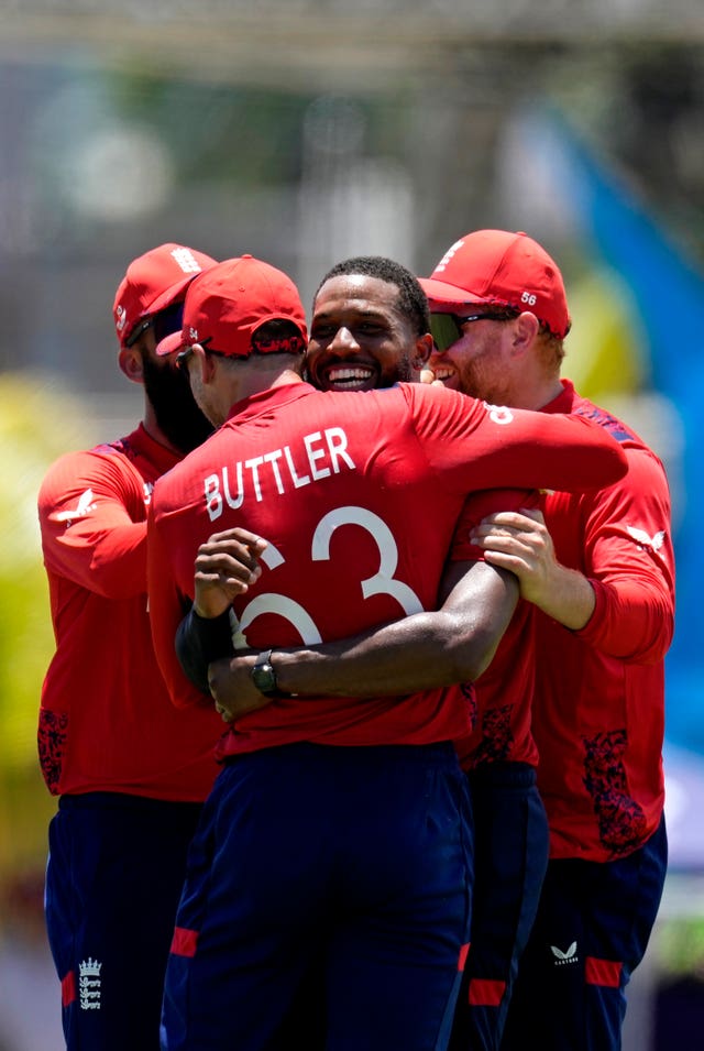 Chris Jordan, second right, celebrates with his England team-mates after his hat-trick