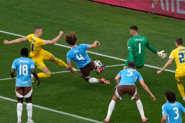 Ukraine’s Artem Dovbyk makes an attempt to score