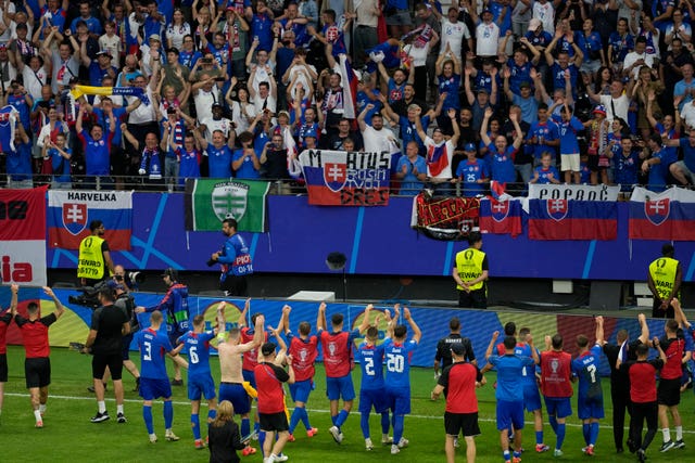 Slovakia's players celebrate in front of their fans