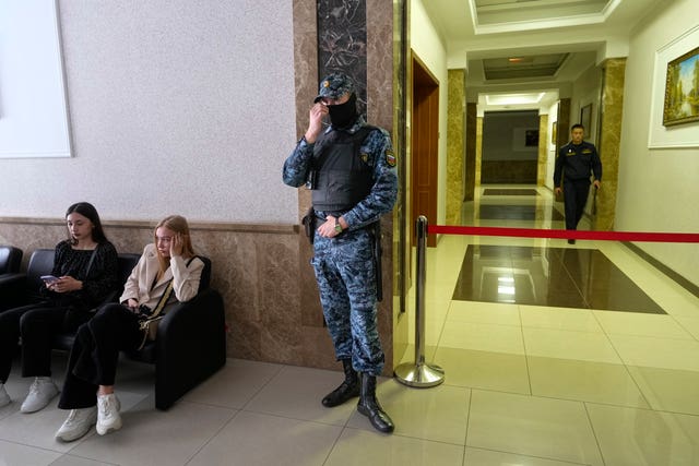 A Russian Federal Bailiffs Service employee guards a corridor leading to a courtroom inside the court in Yekaterinburg