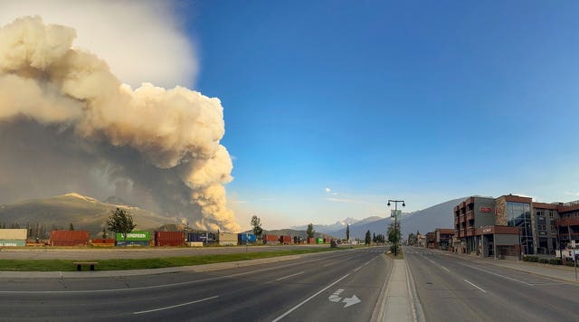 Smoke rises from a wildfire burning near Jasper in Alberta, Canada