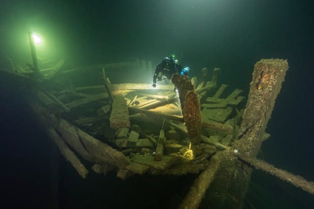 A diver from the Polish Baltictech team inspects the wreckage