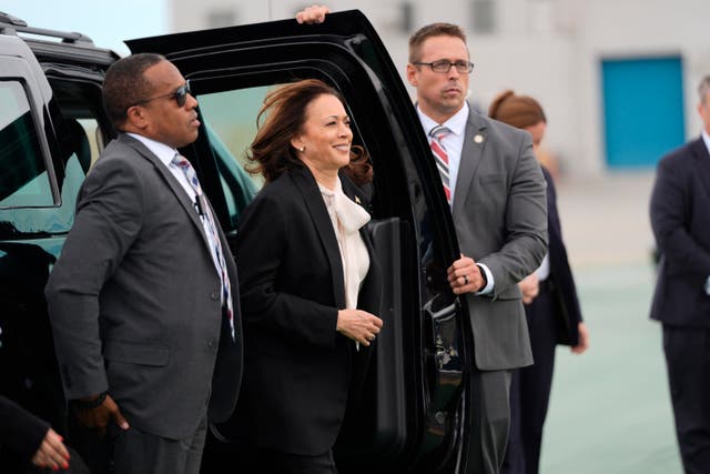 Democratic presidential nominee vice president Kamala Harris, centre, arrives to board Air Force Two at San Francisco International Airport