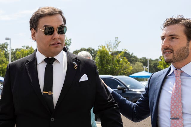 George Santos, left, arrives at court with his lawyer, Andrew Mancilla