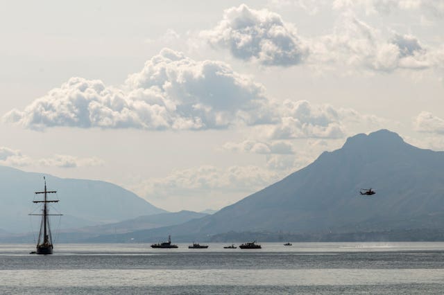 Rescuers work in the area where the Bayesan sank