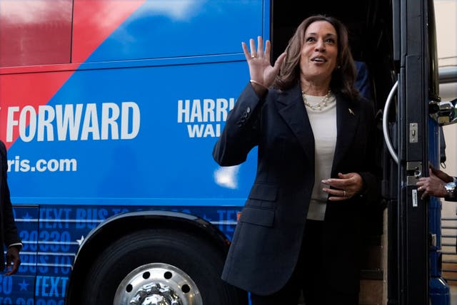 Kamala Harris waves as she exits her campaign bus in Savannah, Georgia