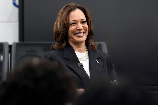 Kamala Harris speaks to marching band members at Liberty County High School in Hinesville