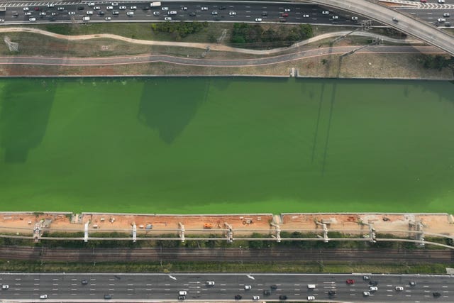 The Pinheiros River is green in Sao Paulo, Brazil