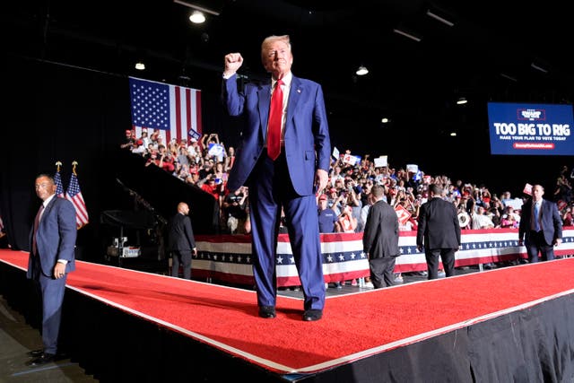 Republican presidential candidate Donald Trump leaves the building after delivering a speech during a campaign rally at the World Market Center in Las Vegas.