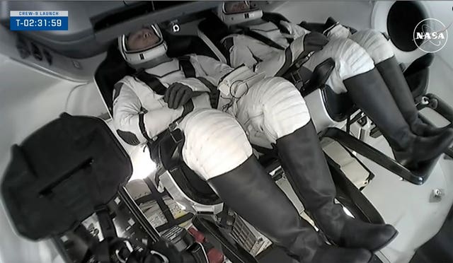 Nick Hague and Aleksandr Gorbunov in the SpaceX capsule