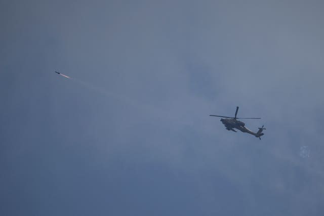 An Israeli Apache helicopter fires a missile towards southern Lebanon