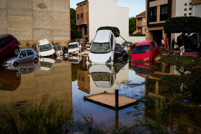 Flooded cars piled up in Valencia, Spain