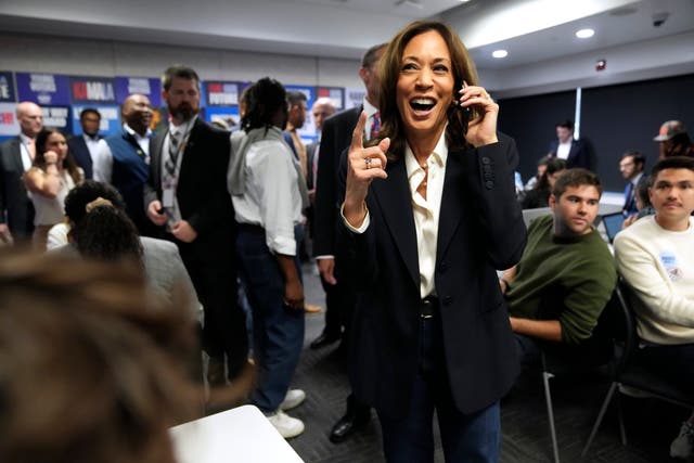 Democratic presidential nominee Kamala Harris, right, phone banks with volunteers at the DNC headquarters on Election Day in Washington