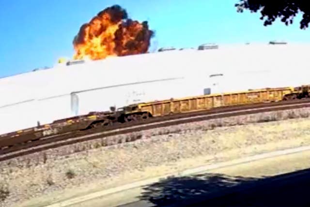 This image taken from video, shows an explosive fire as a small plane crashes into a commercial building in Fullerton