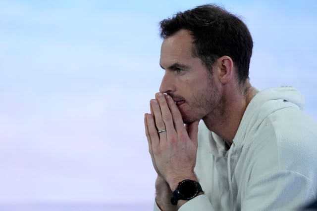 Andy Murray watches from the sidelines