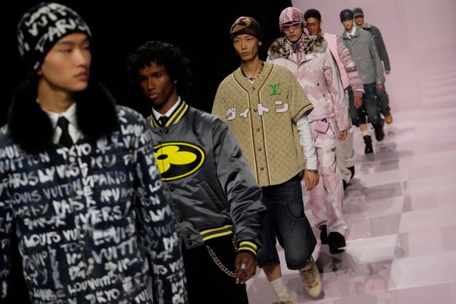 Models wear creations as part of the men's Louis Vuitton Fall-Winter 2025-2026 collection, that was presented in Paris