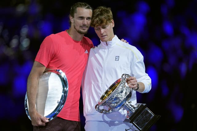 Jannik Sinner, right, embraces Alexander Zverev