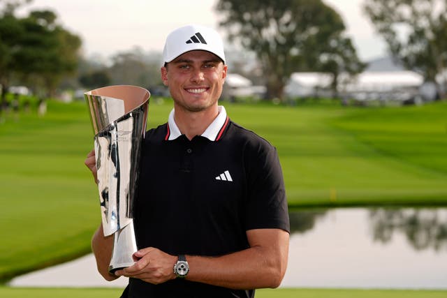 Ludvig Aberg with the Genesis Invitational trophy