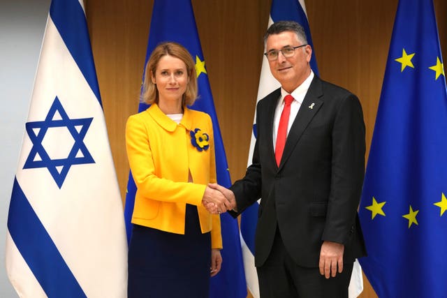 European Union foreign policy chief Kaja Kallas shakes hands with Israel’s foreign minister Gideon Saar